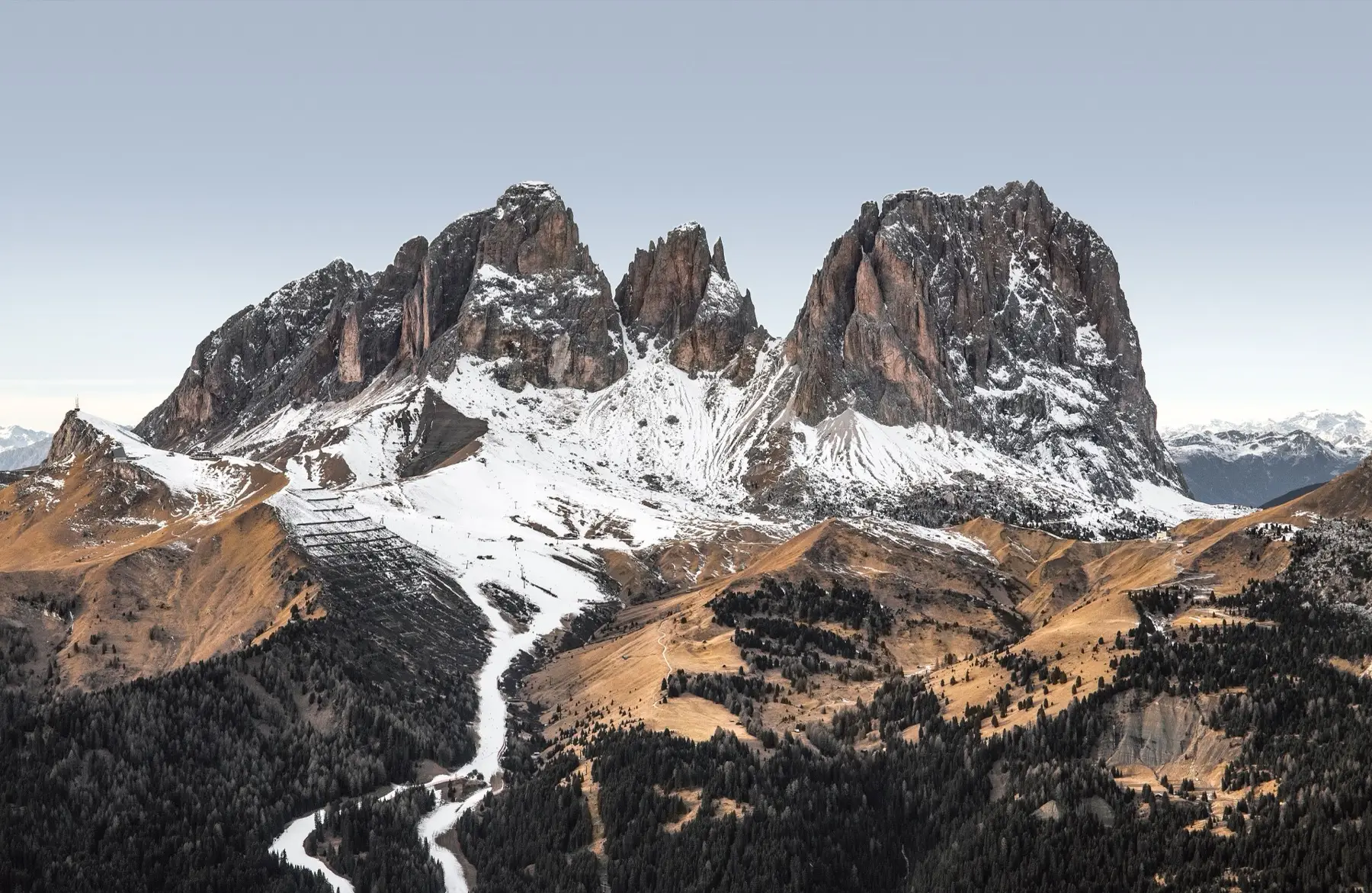 The Sassolungo group above the snowy Sella pass road