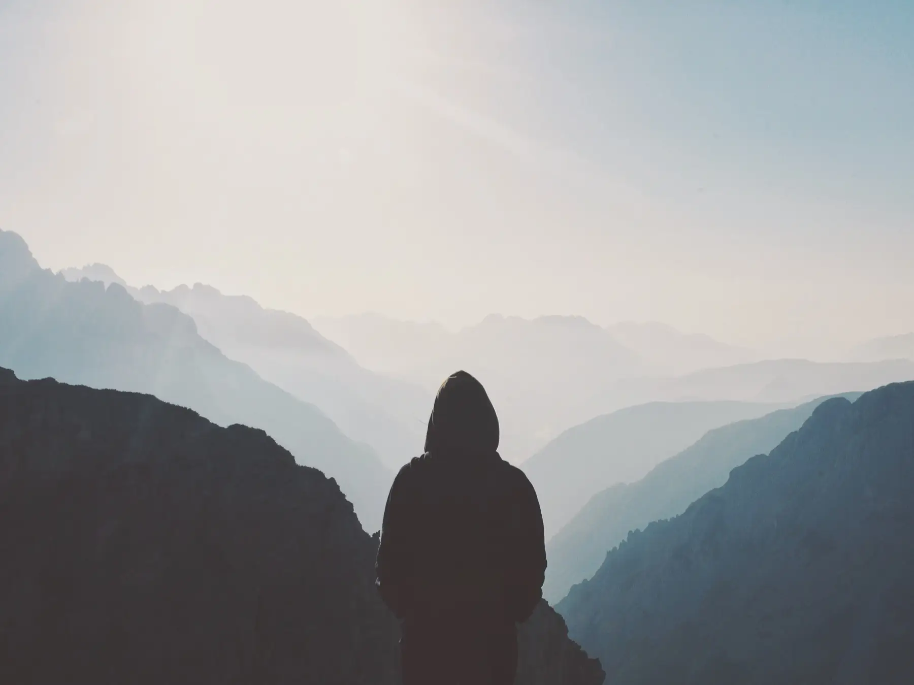 Walkers on a misty mountain path
